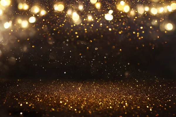 Glitzernde Vintage-Lichter Hintergrund. Schwarz und Gold. Defokussiert — Stockfoto