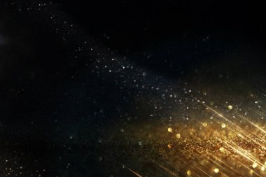 Glitter vintage ışıklar arka plan. siyah ve altın. de-odaklı