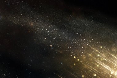 Glitter vintage ışıklar arka plan. siyah ve altın. de-odaklı