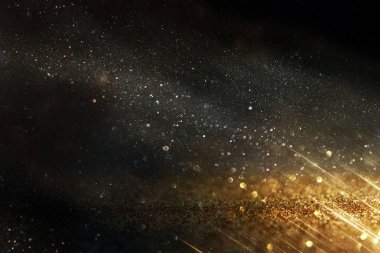 Glitter vintage ışıklar arka plan. siyah ve altın. de-odaklı