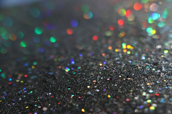 Glitter black lights background with colorful bokeh. de-focused — Stock Photo, Image