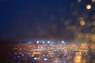 Glitter vintage ışıklar arka plan. siyah, mavi ve altın. de-odaklı