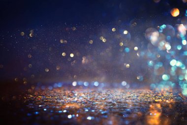 glitter vintage ışıklar arka plan. siyah, mor, mavi ve altın. de-odaklı