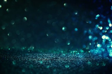 Glitter vintage ışıklar arka plan. siyah ve mavi. de-odaklı