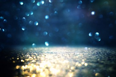 Glitter vintage ışıklar arka plan. siyah, mavi ve altın. de-odaklı