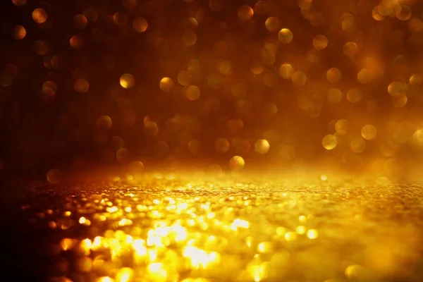 Glitter vintage lights background. black and gold. de-focused — Stock Photo, Image