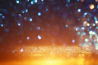 Glitter vintage ışıklar arka plan. siyah, mavi ve altın. de-odaklı