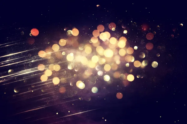 Glitter vintage lights background. black and gold. de-focused — Stock Photo, Image