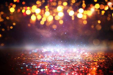 glitter vintage ışıklar arka plan. siyah, altın ve kırmızı. de-odaklı