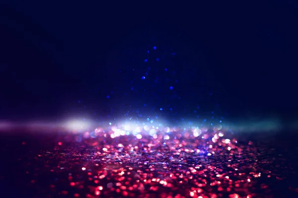 Glitter vintage lights background. black, gold, purple, blue and red. de-focused — Stock Photo, Image