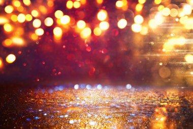 glitter vintage ışıklar arka plan. siyah, altın ve kırmızı. de-odaklı