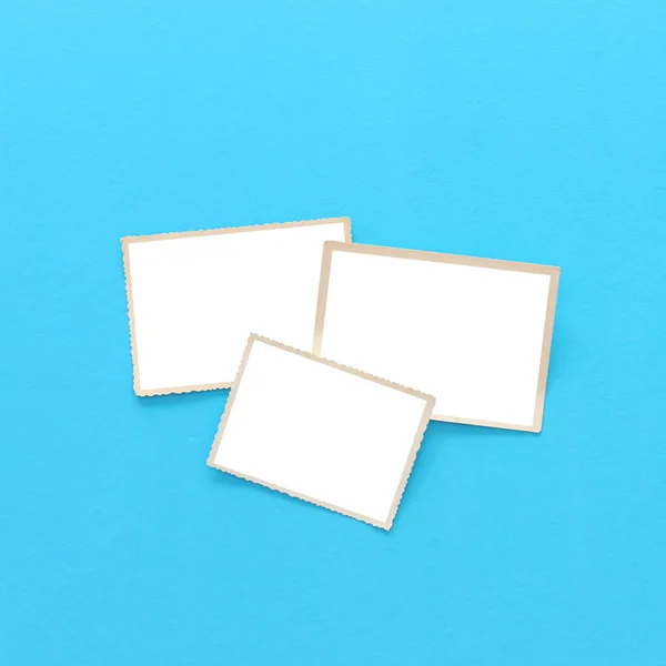 Top view of blank photo frames over blue background. Top view flat lay — Stock Photo, Image