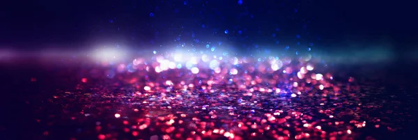 Glitter vintage lights background. black, gold, purple, blue and — Stock Photo, Image