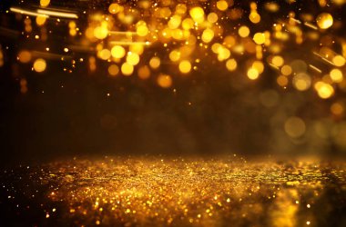 Glitter vintage ışıklar arka plan. siyah ve altın. de-odaklı