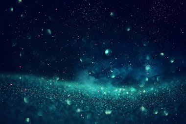 glitter vintage ışıklar arka plan. siyah, mavi, yeşil ve gümüş. de-odaklı