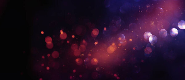 Abstract glitter lights background. red, black, purple and gold. de-focused. banner