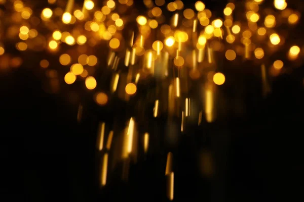 Блестки винтажные огни фона. черный и золотой. de-focused — стоковое фото