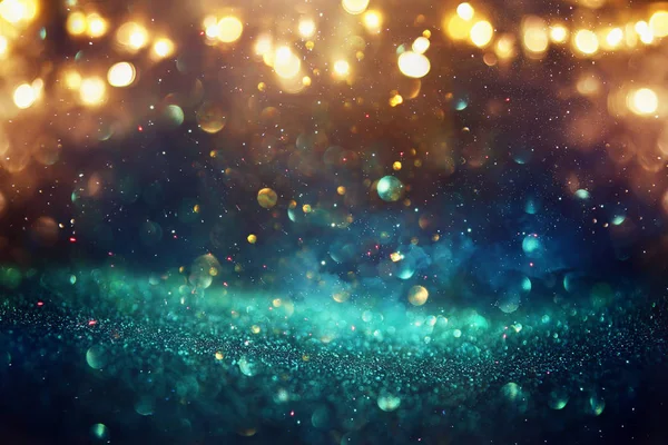 Glitter vintage lights background. black, blue, gold and green. de-focused — Stock Photo, Image