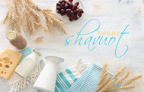 Top view photo of dairy products over white wooden background. Symbols of jewish holiday - Shavuot — Stock Photo, Image