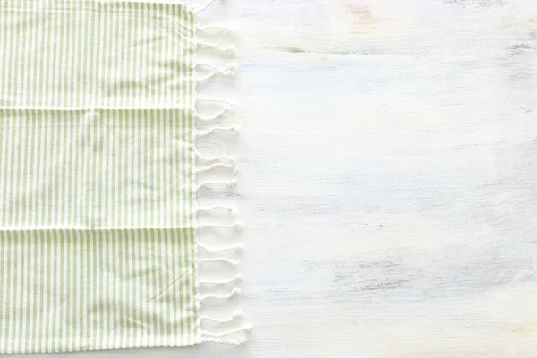 Top view of vintage fabric with over white wooden background — Stock Photo, Image