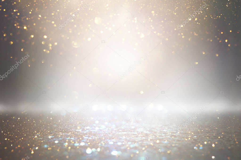 abstract glitter silver and gild lights background. de-focused