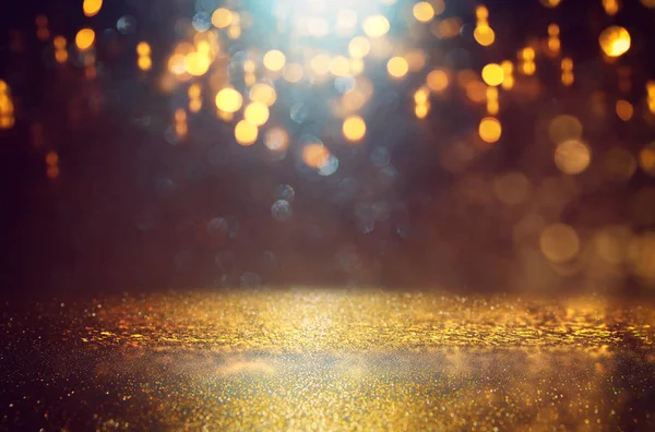 Abstract glitter black and gold lights background. de-focused — Stock Photo, Image