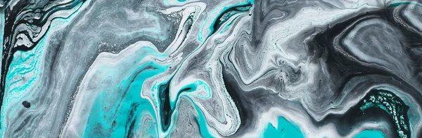 photography of abstract marbleized effect background. black, light turquoise and white creative colors. Beautiful paint. banner