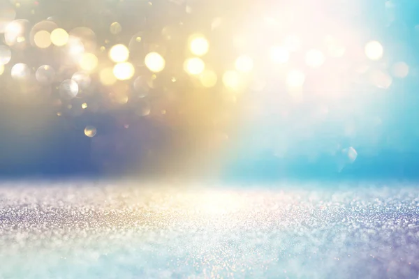 Abstract glitter lights background. golden and light blue. de-focused — Stock Photo, Image