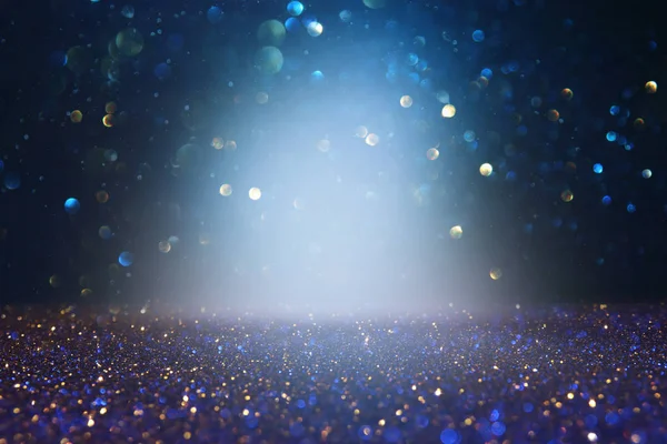 Abstract glitter lights background. blue, gold and black. de focused. — Stock Photo, Image