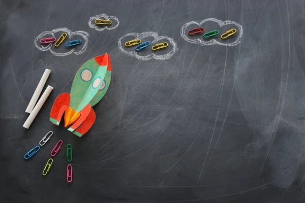 Education. Back to school concept. rocket cut from paper and painted over blackboard background. top view, flat lay — Stock Photo, Image