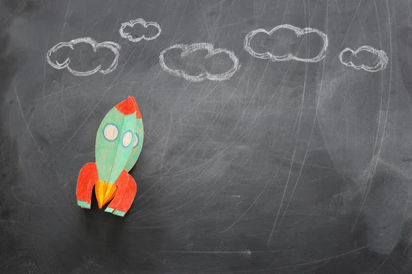 Education. Back to school concept. rocket cut from paper and painted over blackboard background. top view, flat lay — Stock Photo, Image