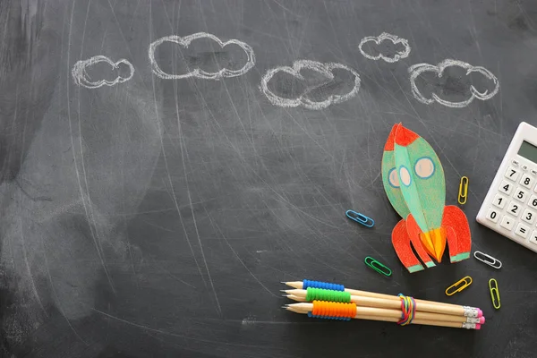 Education. Back to school concept. rocket cut from paper and painted over blackboard background. top view, flat lay — Stock Photo, Image