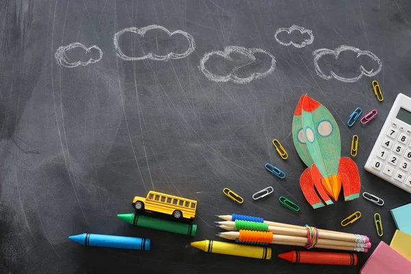 Education. Back to school concept. rocket cut from paper and painted over blackboard background. top view, flat lay — Stock Photo, Image