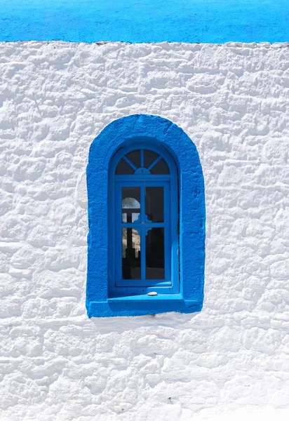 Landmark photo of blue window typical Greek bulding — Stock Photo, Image