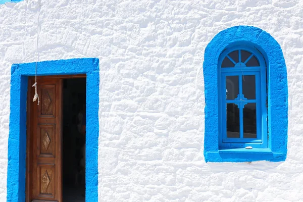 Landmark photo of blue window typical Greek bulding — Stock Photo, Image