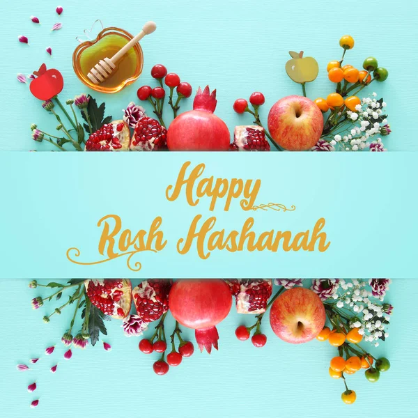 Religion image of Rosh hashanah (jewish New Year holiday) concept. Traditional symbols over wooden mint blue pastel background — Stock Photo, Image