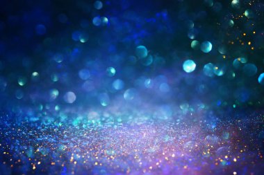 soyut glitter ışıkları niçin kara zemin. mavi, altın ve siyah. de odaklı