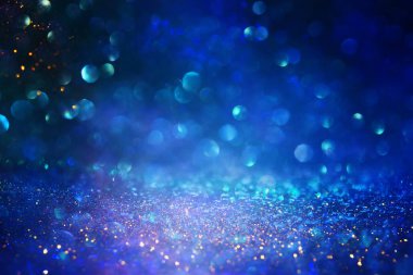 soyut glitter ışıkları niçin kara zemin. mavi, altın ve siyah. de odaklı