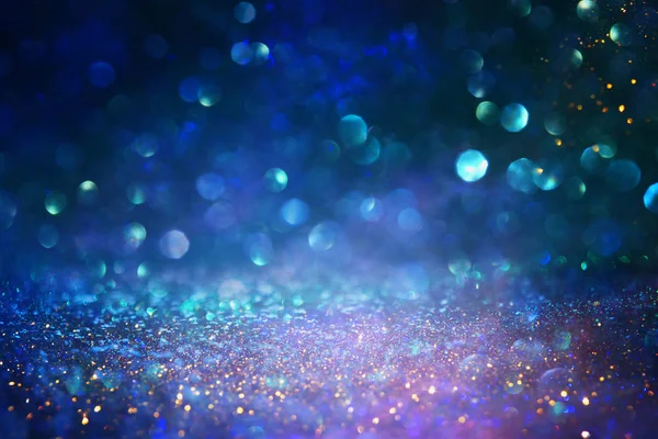 Blackground of abstract glitter lights. blue, gold and black. de focused — Stock Photo, Image