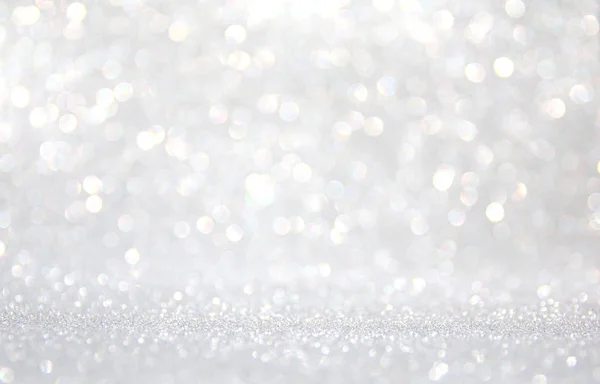 Sfondo di luci glitter astratte. argento e bianco. sfocato — Foto Stock