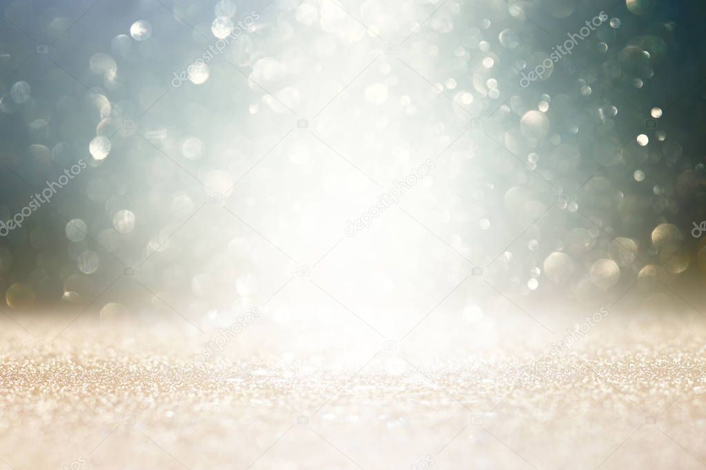 background of abstract glitter lights. gold and black. de-focused.