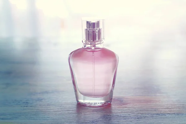 Beauty/fashion Image of elegant perfume bottle over pastel background. vintage filtered image — Stock Photo, Image