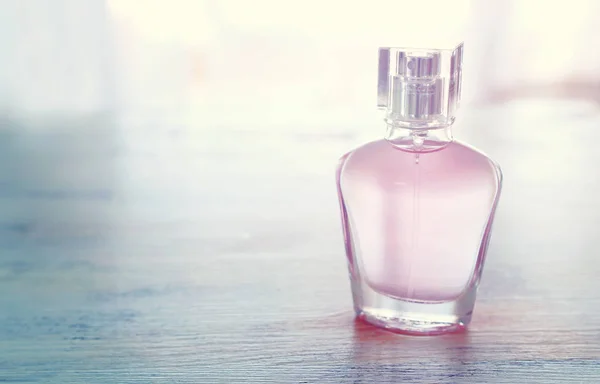 Beauty/fashion Image of elegant perfume bottle over pastel background. vintage filtered image — Stock Photo, Image