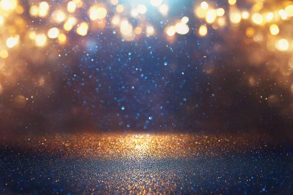 Blackground of abstract glitter lights. синий, золотой и черный. de focused — стоковое фото