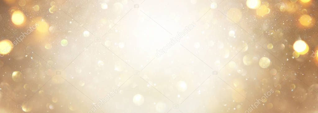 blackground of abstract glitter lights. silver and gold. de-focu