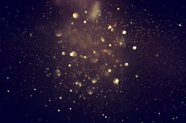soyut glitter ışıkları niçin kara zemin. mavi, altın ve siyah. de odaklı
