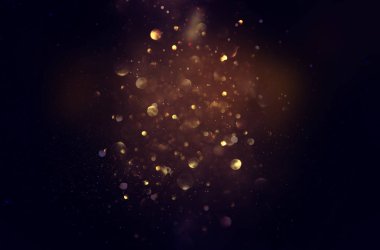 soyut glitter ışıkları niçin kara zemin. mavi, altın ve siyah. de odaklı