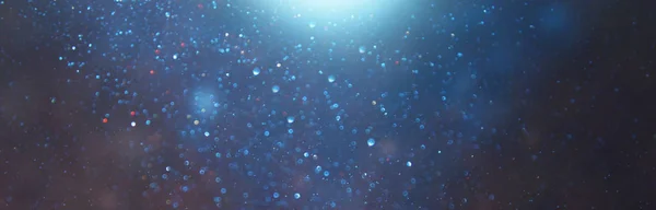 Blackground of abstract glitter lights. blue, gold and black. de focused. banner — Stock Photo, Image