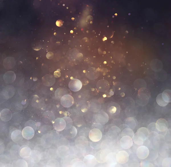 Blackground of abstract glitter lights. blue, gold and black. de focused — Stock Photo, Image