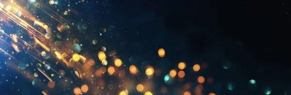 Hintergrund abstrakter Glitzerlichter. blau, gold und schwarz. Defokussiert. Banner — Stockfoto